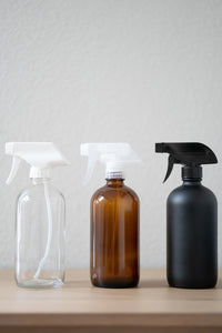Clear, Amber, Matte Black refillable glass cleaner spray bottles