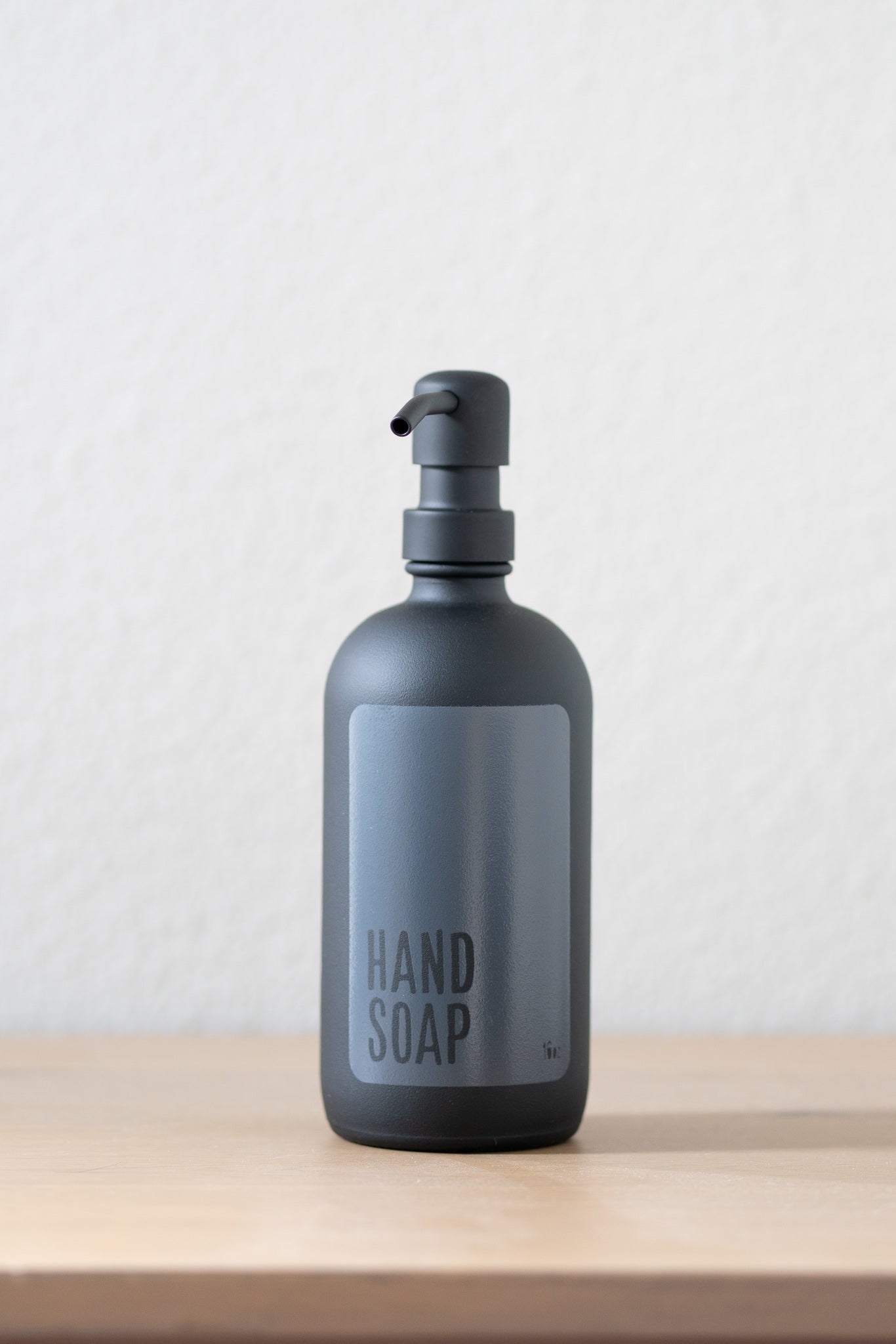 Reusable matte black glass hand soap dispenser with black metal pump