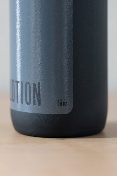 Refillable matte black glass lotion bottle