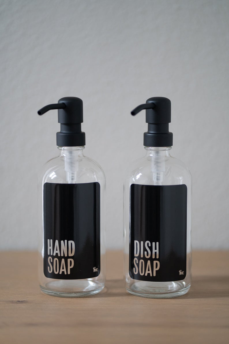 Clear Glass with black hand and dish soap dispensers