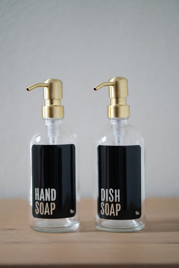 https://urbanember.com/cdn/shop/products/clear-glass-modern-black-hand-soap-dish-soap-gold-pump_1024x1024.jpg?v=1628100864