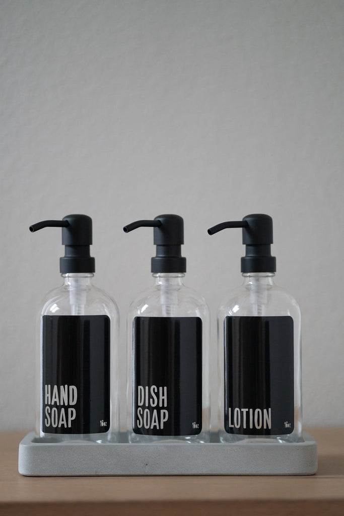https://urbanember.com/cdn/shop/products/clear-glass-modern-black-hand-soap-dish-soap-lotion-stainless-steel-pump-concrete-tray_1024x1024.jpg?v=1628100864