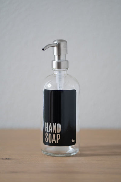 Clear glass with black hand soap bottle